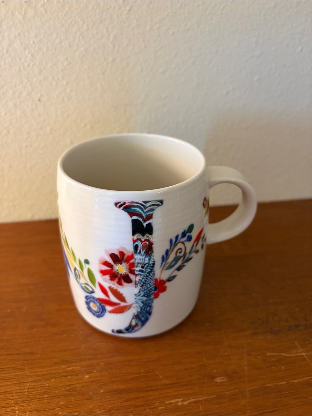 Anthropologie White Mug with Red, Blue, Green and Gold Floral 'J'